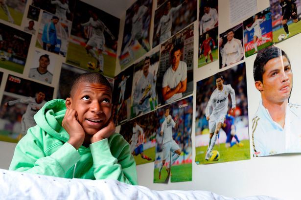 Kylian Mbappe covered walls in Cristiano Ronaldo pictures